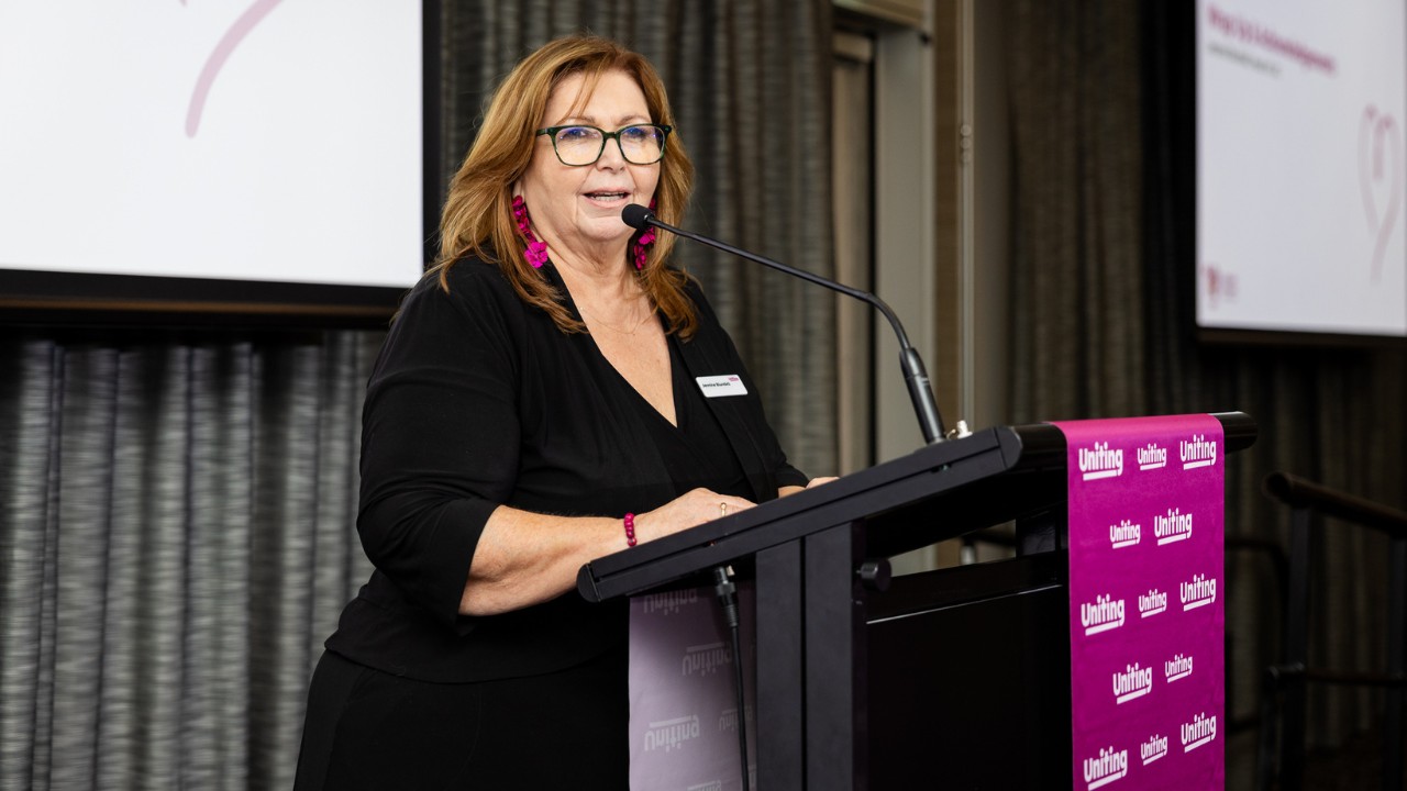Jennine Blundell speaking at a podium. Jennine Blundell speaking at a podium.